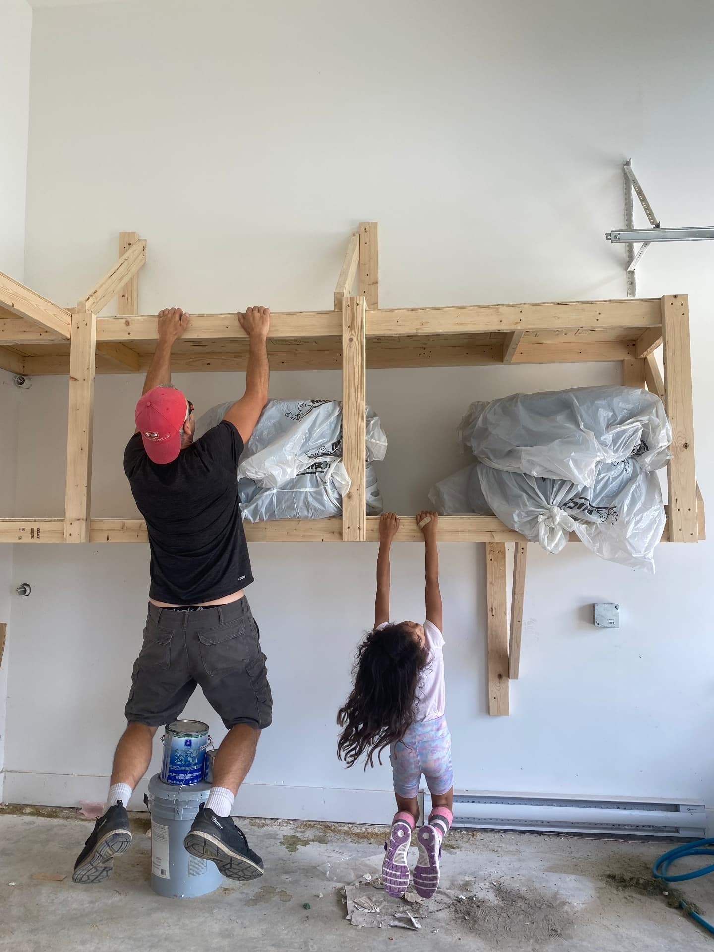 Fraser installing custom garage shelving